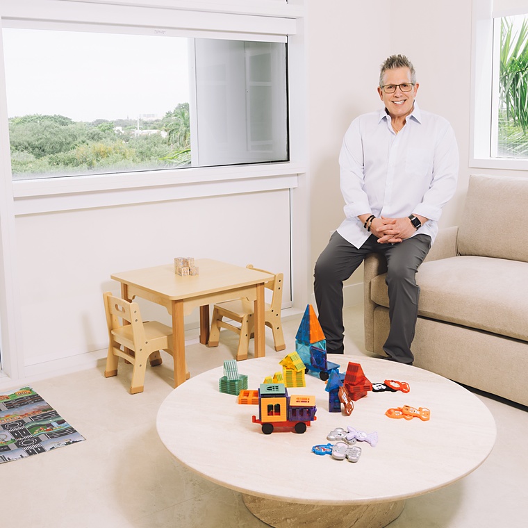 Dr. Jay Harvey seated in a pediatric exam room